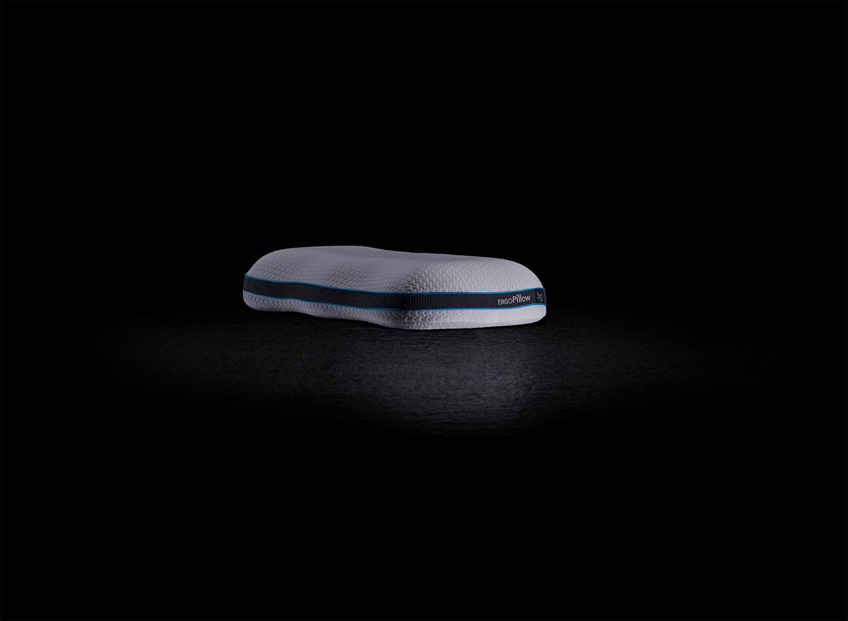 An image of the ErgoPillow, featuring its ergonomic design and plush comfort for optimal neck and head support during sleep.